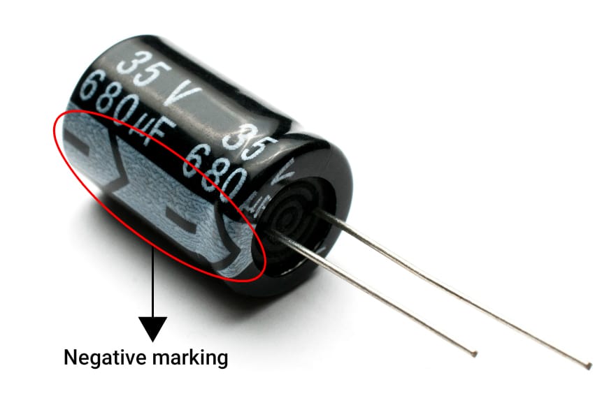 negative-polarity-marking-on-the-capacitor-represented-by-the-arrow-band-with-minus-sign.jpg